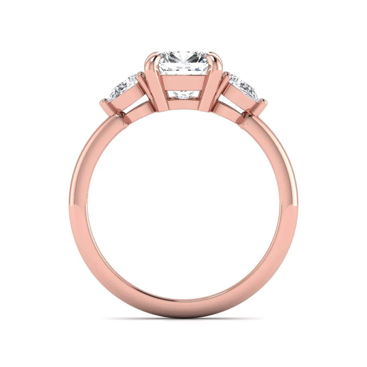 Cushion cut lab grown diamond three stone engagement ring with pear cut side diamonds in a classic prong setting in rose gold