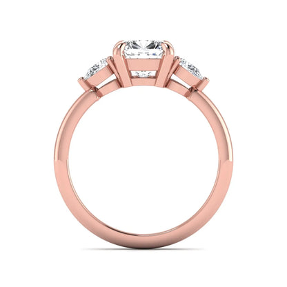 Cushion cut lab grown diamond three stone engagement ring with pear cut side diamonds in a classic prong setting in rose gold