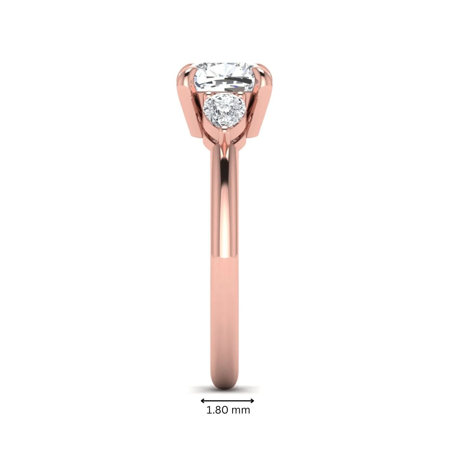 Cushion cut lab grown diamond three stone engagement ring with pear cut side diamonds in a classic prong setting in rose gold