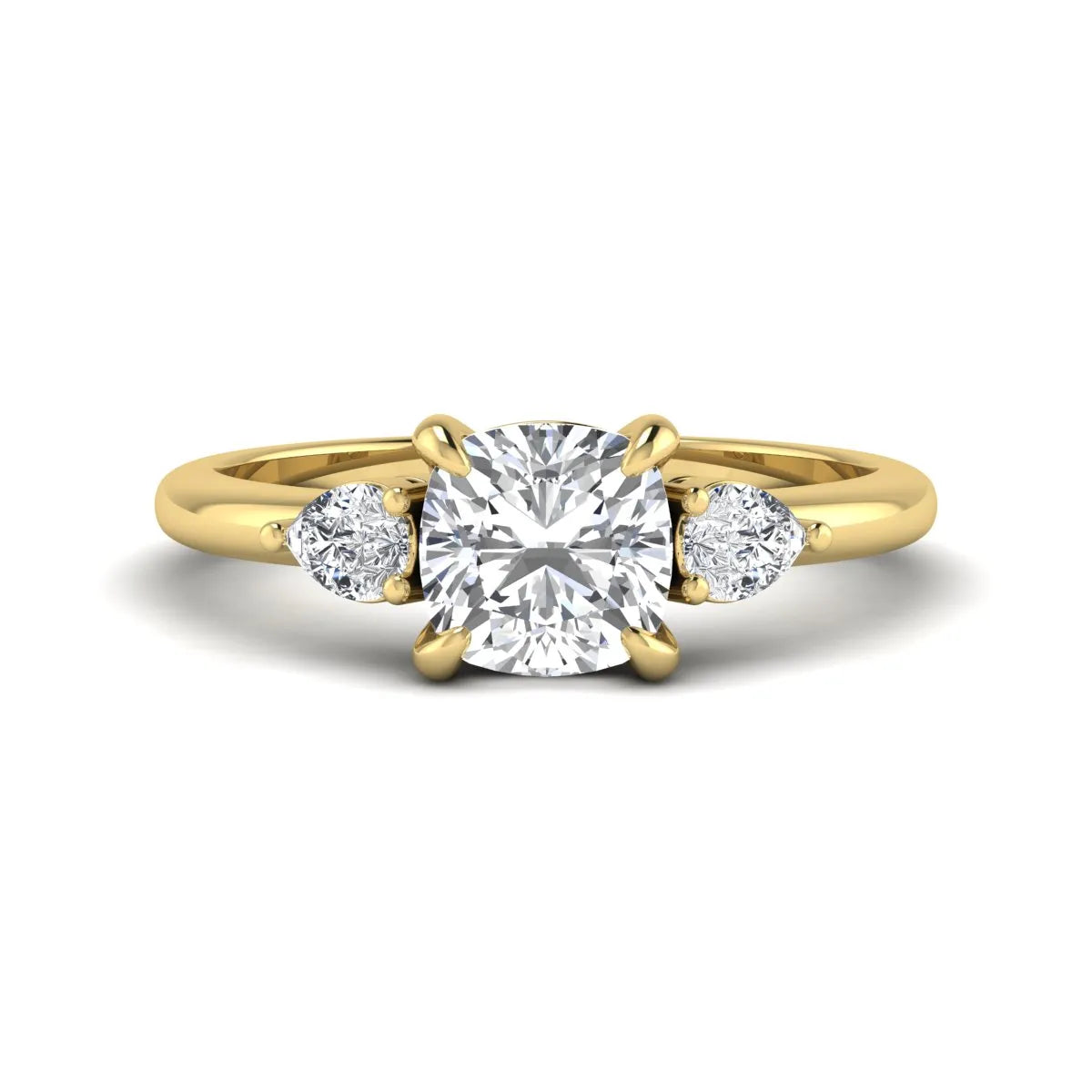 Cushion cut lab grown diamond three stone engagement ring with pear cut side diamonds in a classic prong setting in yellow gold