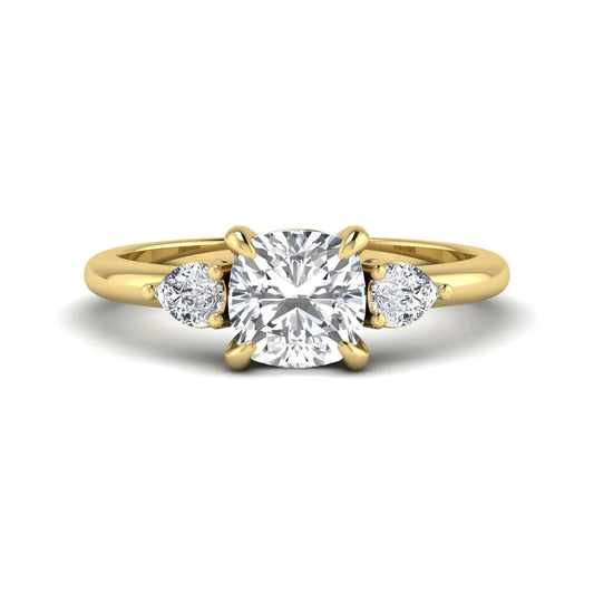 Cushion cut lab grown diamond three stone engagement ring with pear cut side diamonds in a classic prong setting in yellow gold