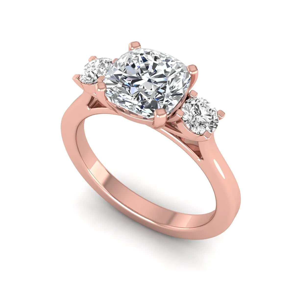 Cushion cut lab grown diamond three stone engagement ring featuring a cushion center diamond with round brilliant side diamonds on a polished rose gold band.