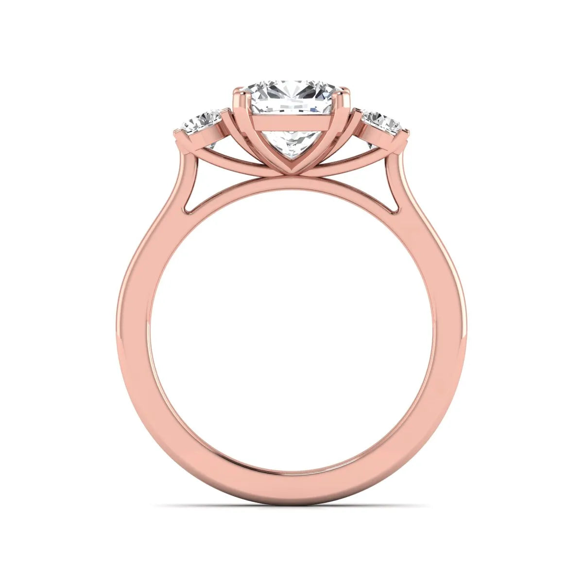 Cushion cut lab grown diamond three stone engagement ring featuring a cushion center diamond with round brilliant side diamonds on a polished rose gold band.