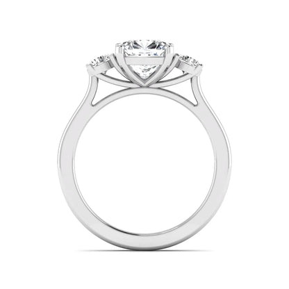 Cushion cut lab grown diamond three stone engagement ring featuring a cushion center diamond with round brilliant side diamonds on a polished white gold band.