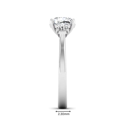 Cushion cut lab grown diamond three stone engagement ring featuring a cushion center diamond with round brilliant side diamonds on a polished white gold band.