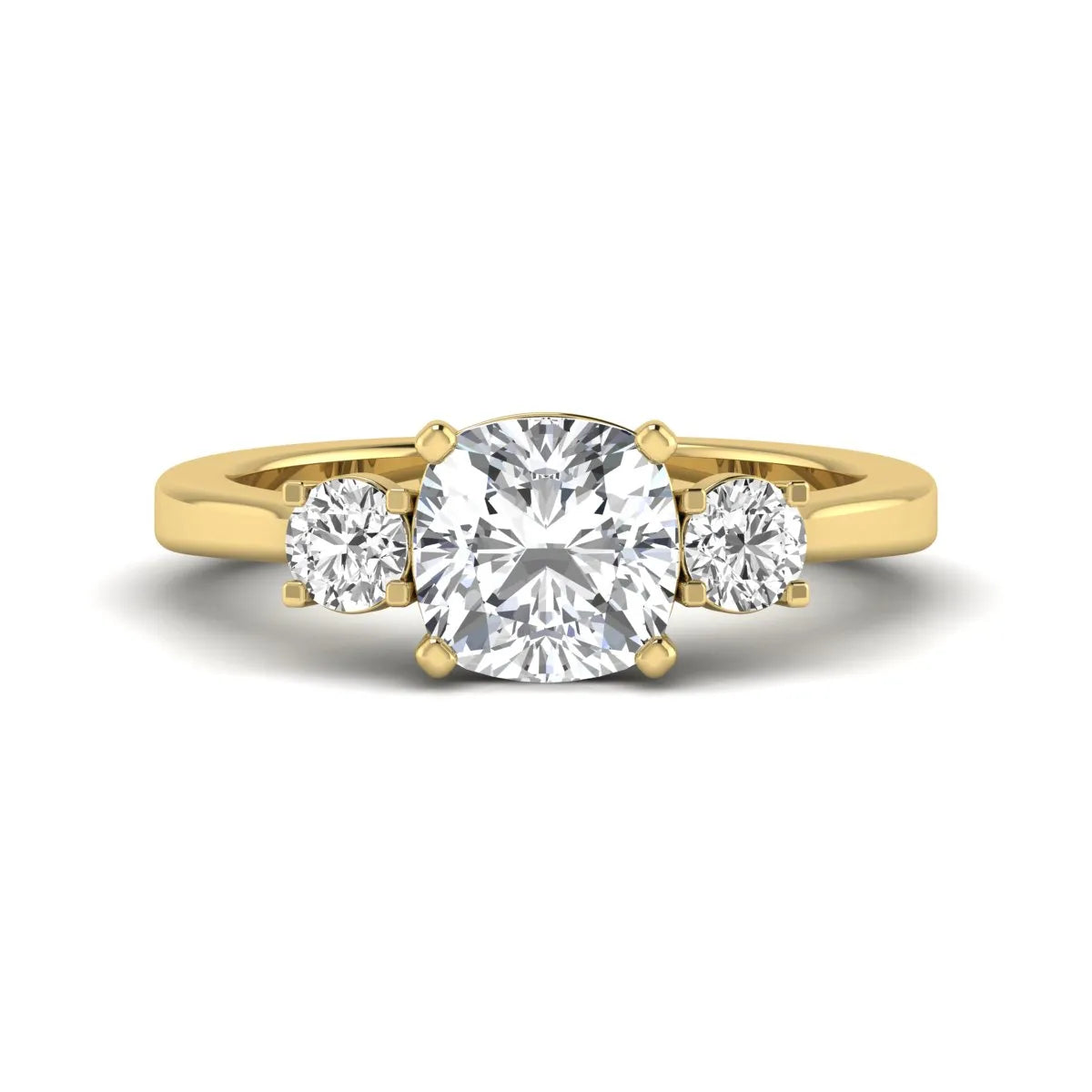 Cushion cut lab grown diamond three stone engagement ring featuring a cushion center diamond with round brilliant side diamonds on a polished yellow gold band.