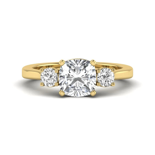 Cushion cut lab grown diamond three stone engagement ring featuring a cushion center diamond with round brilliant side diamonds on a polished yellow gold band.