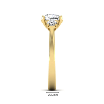 Cushion cut lab grown diamond three stone engagement ring featuring a cushion center diamond with round brilliant side diamonds on a polished yellow gold band.