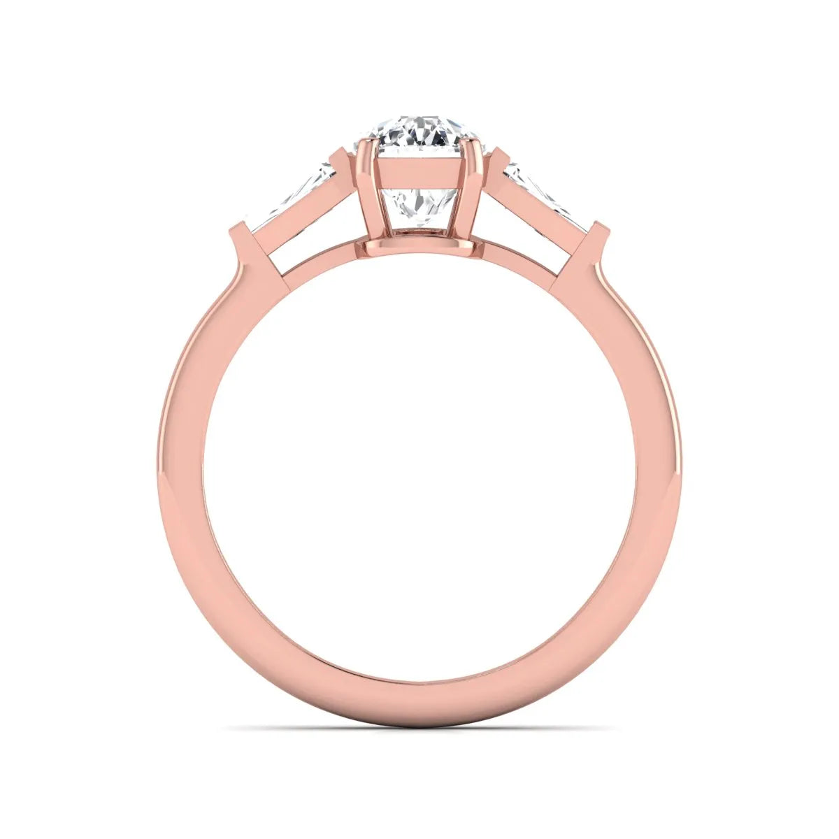 Cushion cut lab grown diamond three stone engagement ring with baguette side diamonds in a four prong setting and rose gold tone band.