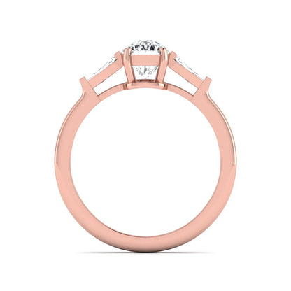 Cushion cut lab grown diamond three stone engagement ring with baguette side diamonds in a four prong setting and rose gold tone band.