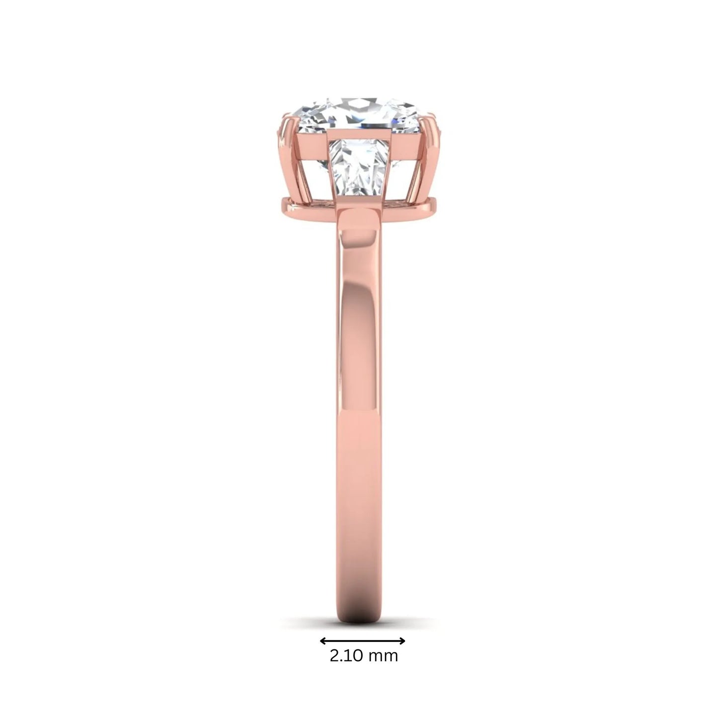 Cushion cut lab grown diamond three stone engagement ring with baguette side diamonds in a four prong setting and rose gold tone band.