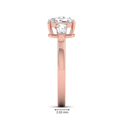 Cushion cut lab grown diamond three stone engagement ring with baguette side diamonds in a four prong setting and rose gold tone band.