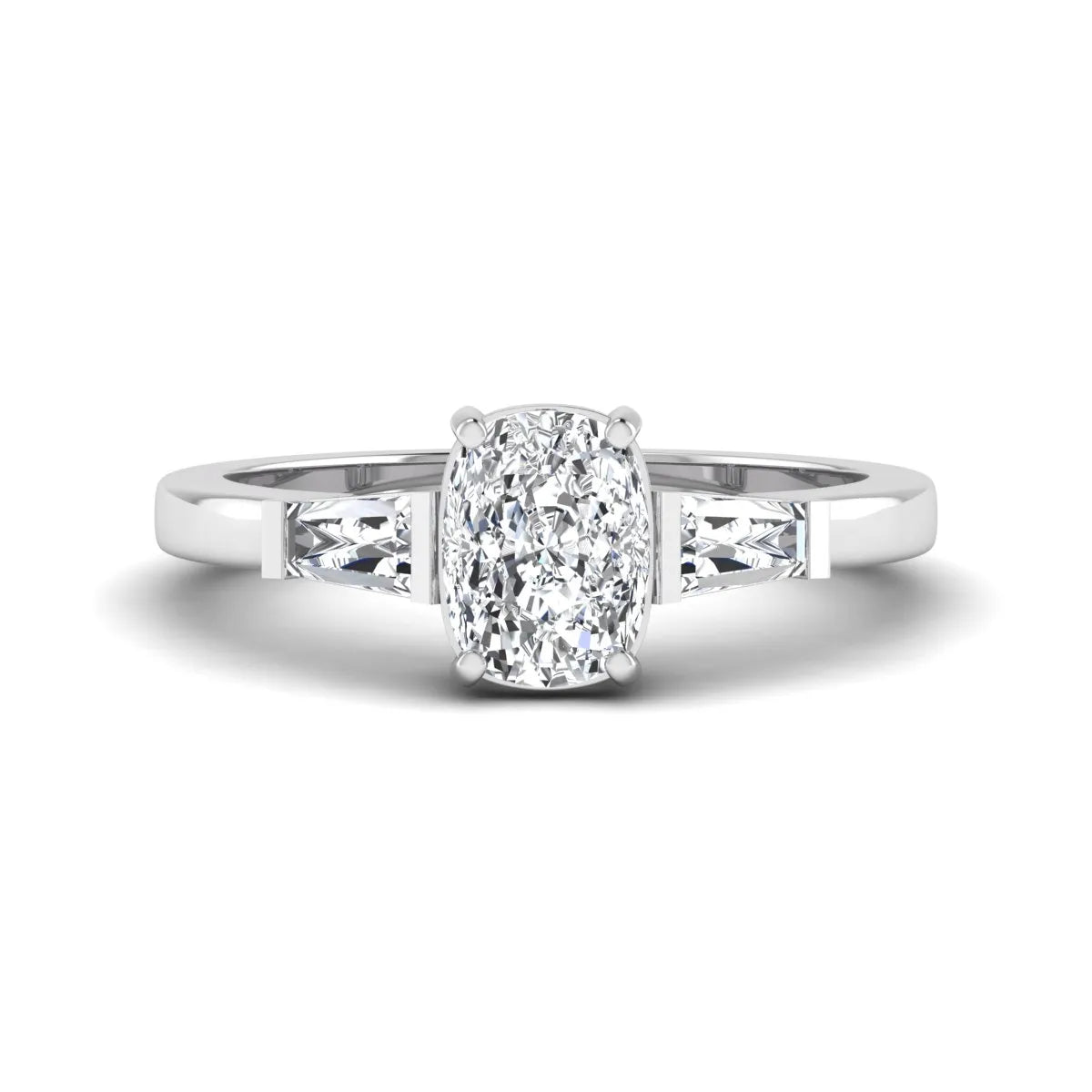 Cushion cut lab grown diamond three stone engagement ring with baguette side diamonds in a four prong setting and white gold tone band.