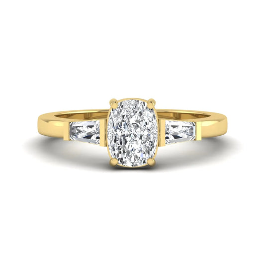 Cushion cut lab grown diamond three stone engagement ring with baguette side diamonds in a four prong setting and yellow gold tone band.