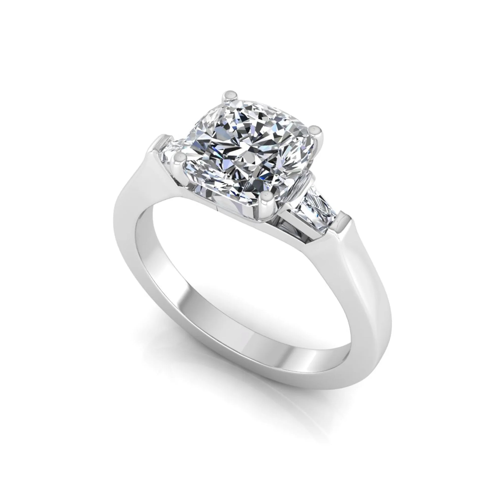 Cushion cut lab grown diamond three stone engagement ring featuring tapered baguette side diamonds in a four prong setting with yellow gold finish. in white gold
