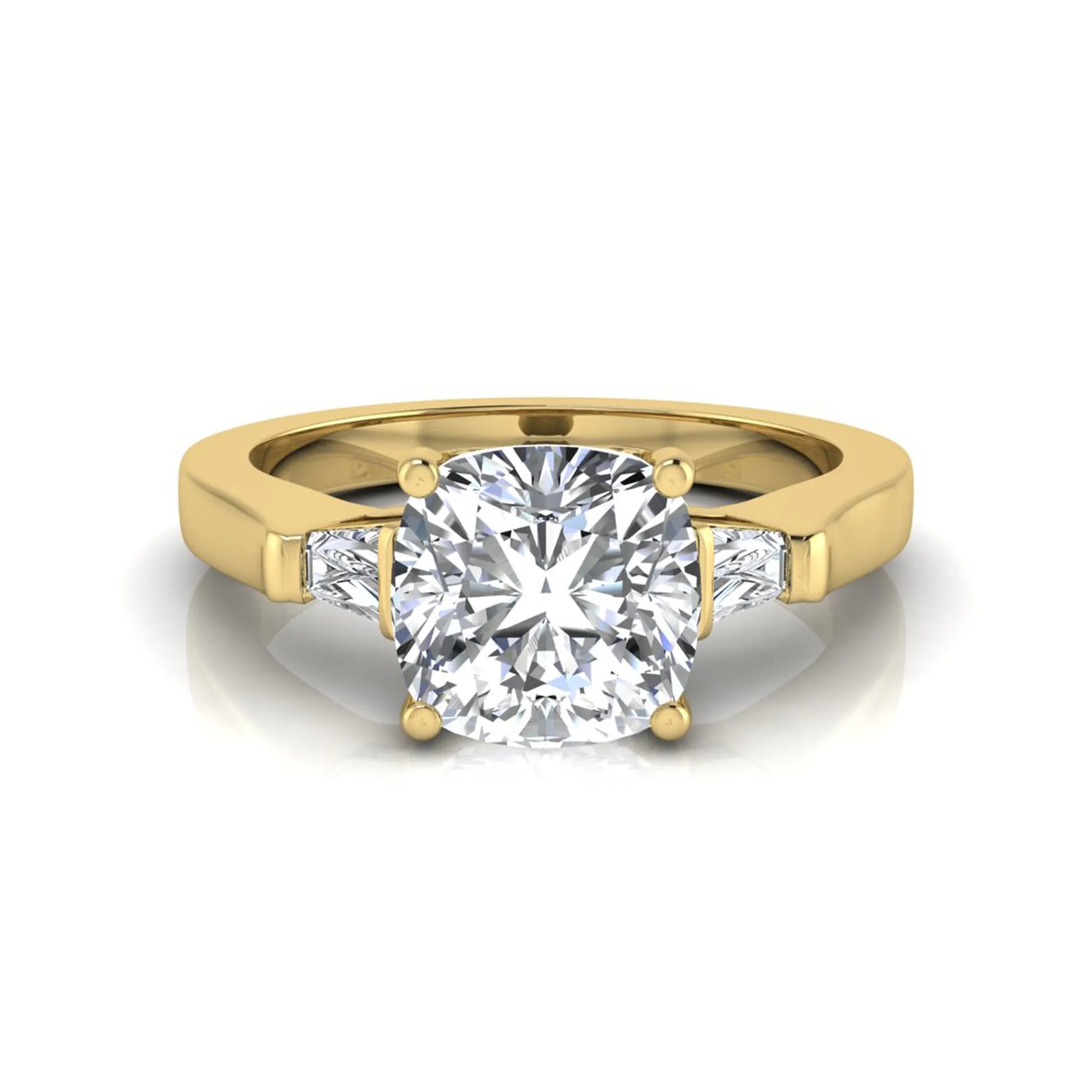 Cushion cut lab grown diamond three stone engagement ring featuring tapered baguette side diamonds in a four prong setting with yellow gold finish. in yellow gold