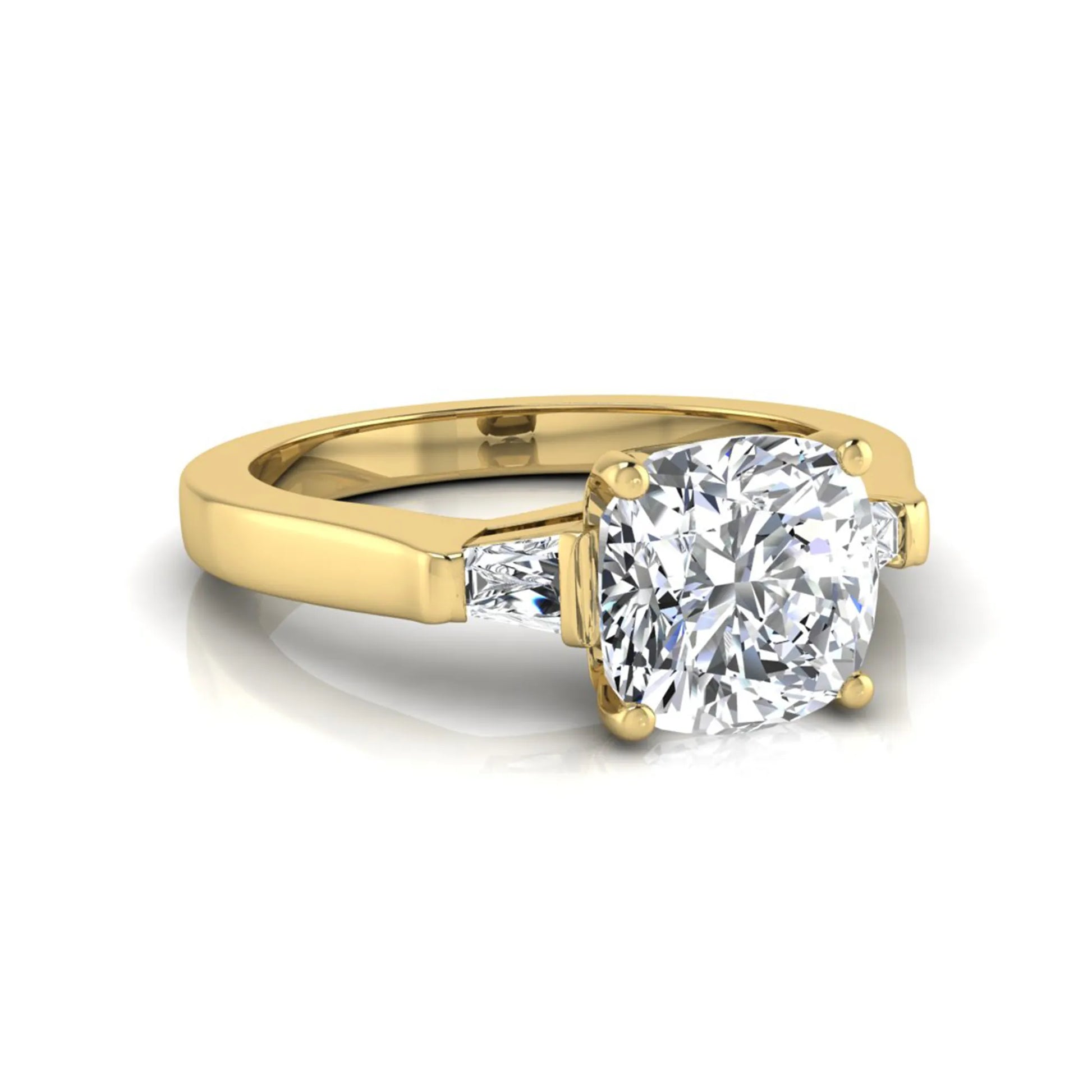 Cushion cut lab grown diamond three stone engagement ring featuring tapered baguette side diamonds in a four prong setting with yellow gold finish. in yellow gold