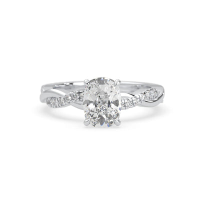 Cushion brilliant lab grown diamond engagement ring with prong setting and twisted pavé diamond band in white gold tone
