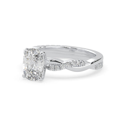 Cushion brilliant lab grown diamond engagement ring with prong setting and twisted pavé diamond band in white gold tone