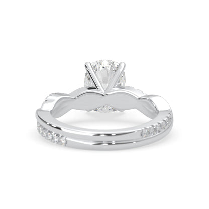 Cushion brilliant lab grown diamond engagement ring with prong setting and twisted pavé diamond band in white gold tone