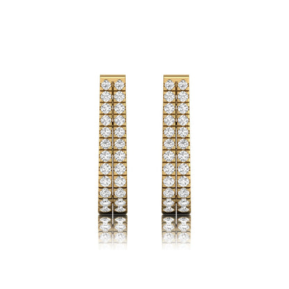 Double row round cut lab grown diamond huggie hoop earrings featuring shared prong set diamonds, hinged snap closure, and polished yellow gold finish.