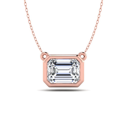 Emerald cut lab grown diamond solitaire pendant necklace with a modern bezel setting in a polished rose gold metal finish.