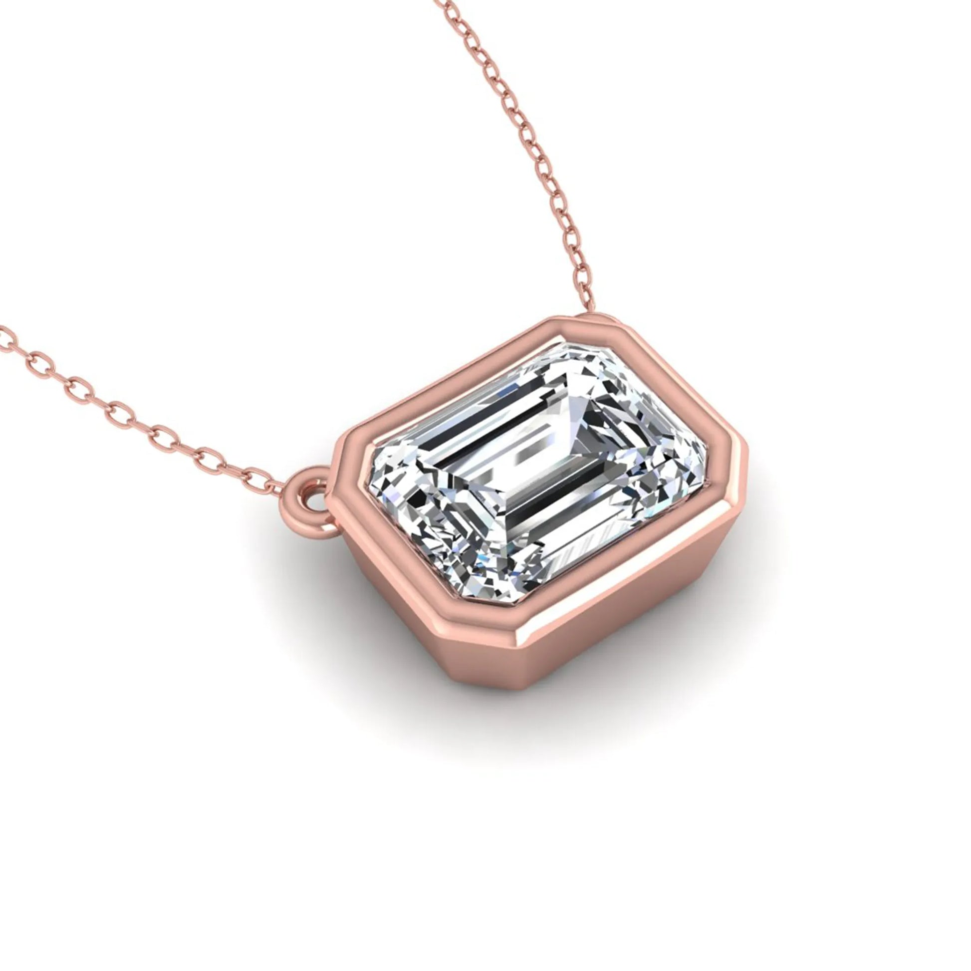 Emerald cut lab grown diamond solitaire pendant necklace with a modern bezel setting in a polished rose gold metal finish.