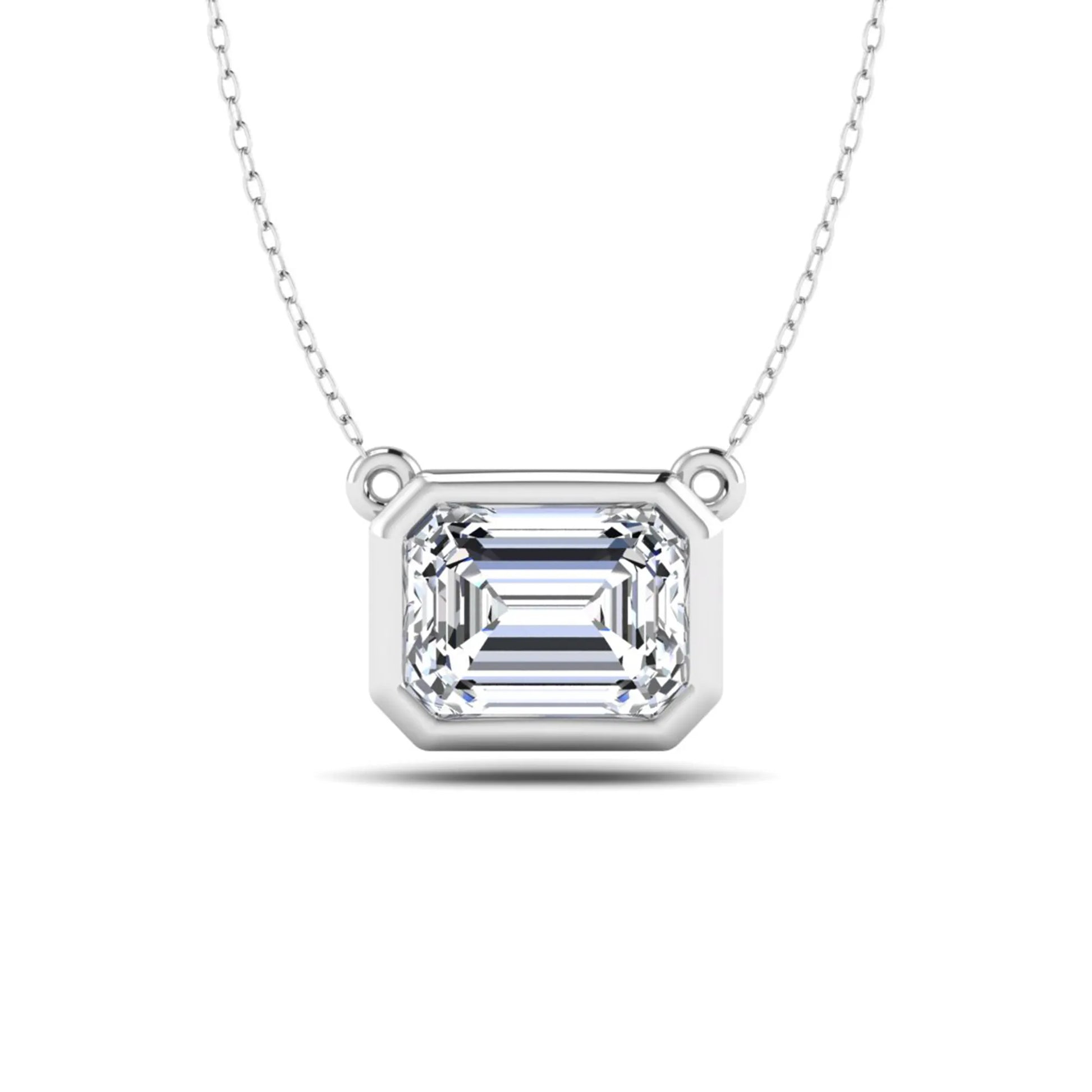 Emerald cut lab grown diamond solitaire pendant necklace with a modern bezel setting in a polished white gold metal finish.