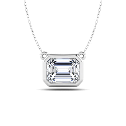 Emerald cut lab grown diamond solitaire pendant necklace with a modern bezel setting in a polished white gold metal finish.