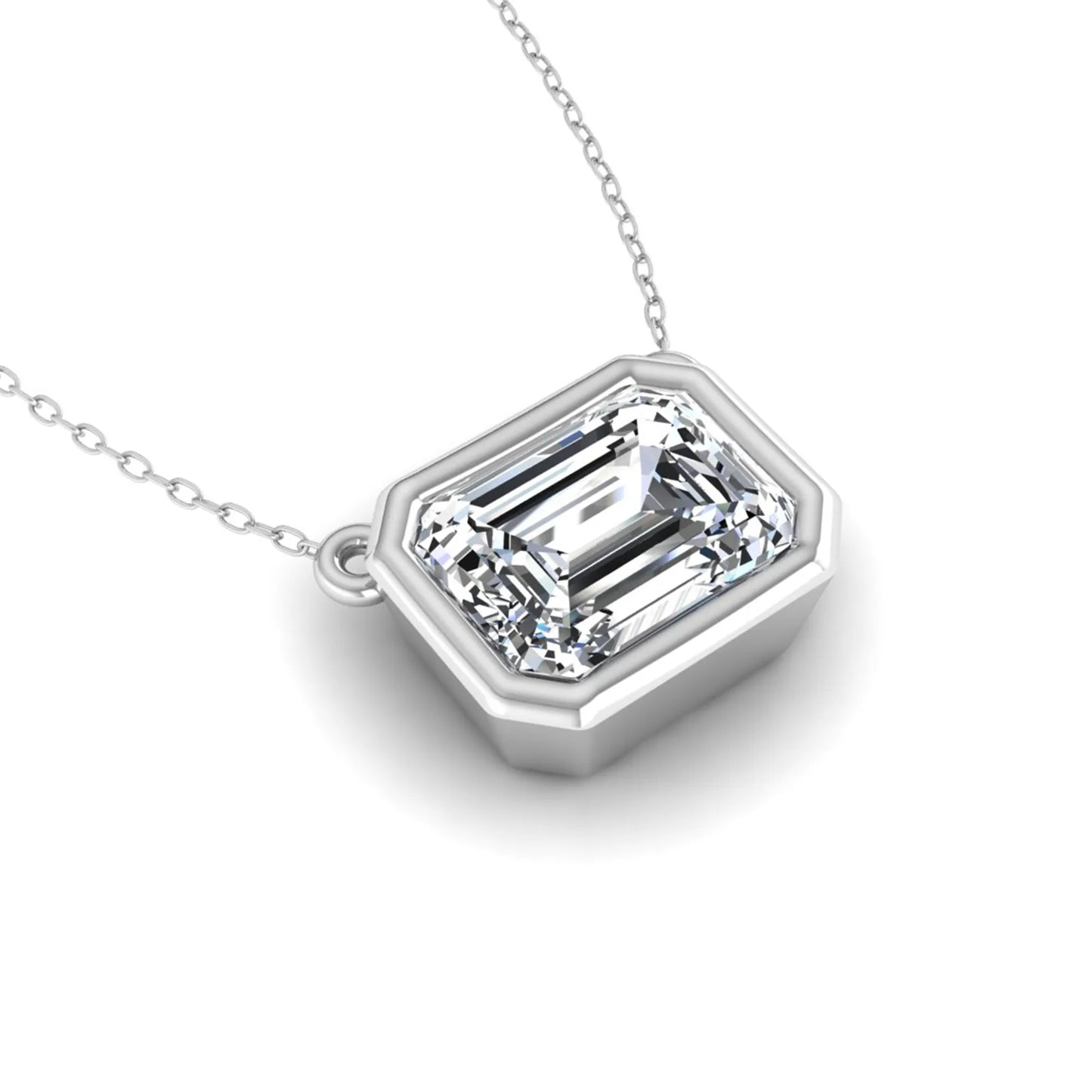 Emerald cut lab grown diamond solitaire pendant necklace with a modern bezel setting in a polished white gold metal finish.
