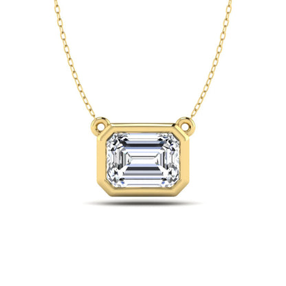 Emerald cut lab grown diamond solitaire pendant necklace with a modern bezel setting in a polished yellow gold metal finish.