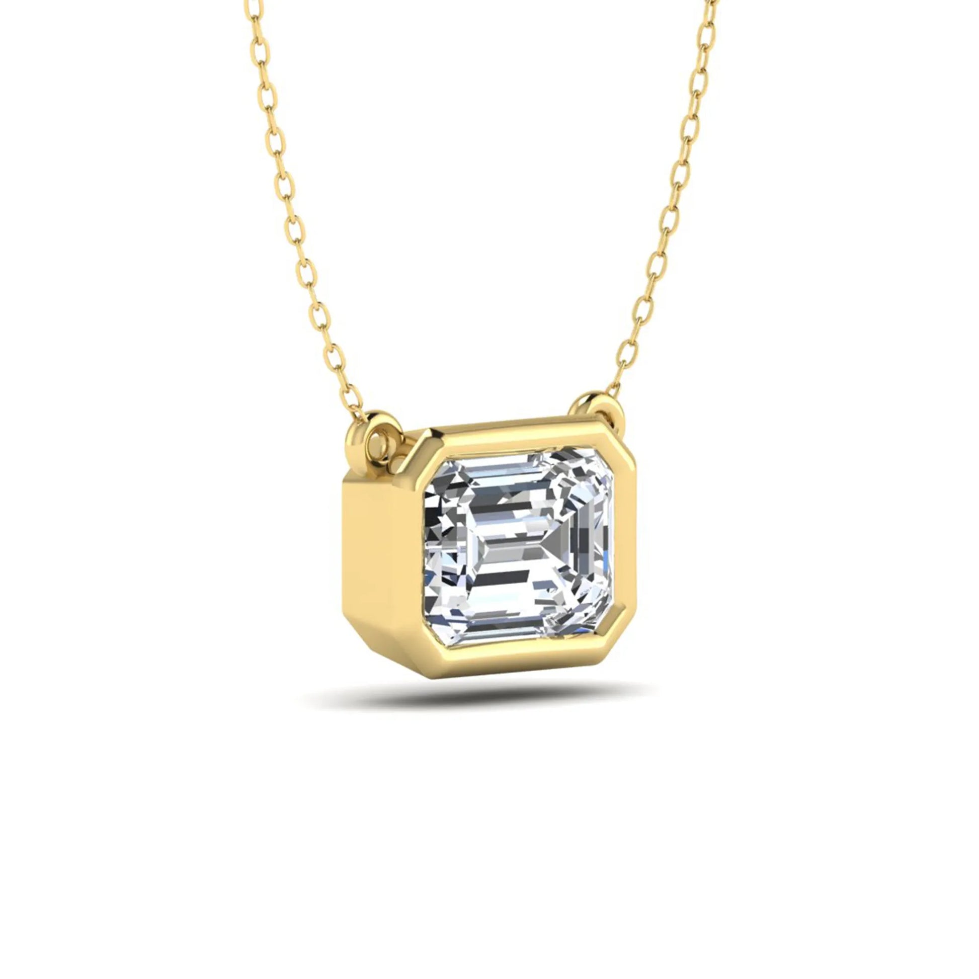 Emerald cut lab grown diamond solitaire pendant necklace with a modern bezel setting in a polished yellow gold metal finish.
