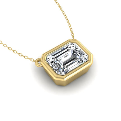 Emerald cut lab grown diamond solitaire pendant necklace with a modern bezel setting in a polished yellow gold metal finish.