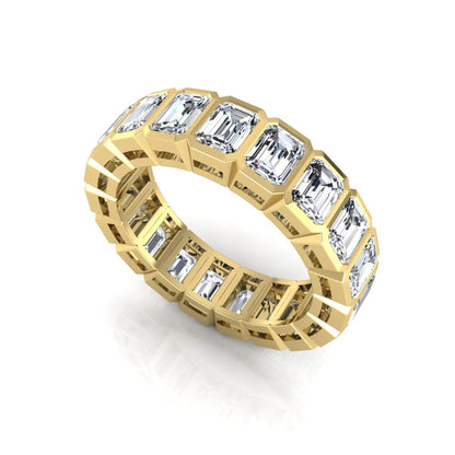 Emerald cut lab grown diamond full eternity band featuring bezel-set diamonds with a yellow gold tone finish.