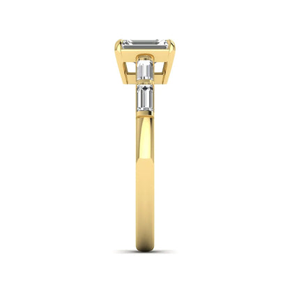 Emerald cut lab grown diamond engagement ring with baguette side diamonds in yellow gold