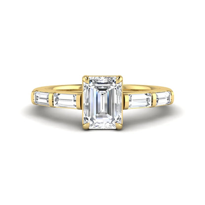Emerald cut lab grown diamond engagement ring with baguette side diamonds in yellow gold