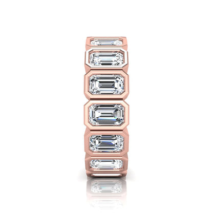 Emerald cut lab grown diamond full eternity ring featuring octagonal bezel-set diamonds in polished rose gold.