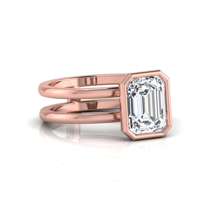 Rose-gold ring with a large diamond on a white background