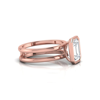 Rose-gold ring with a diamond on a white background