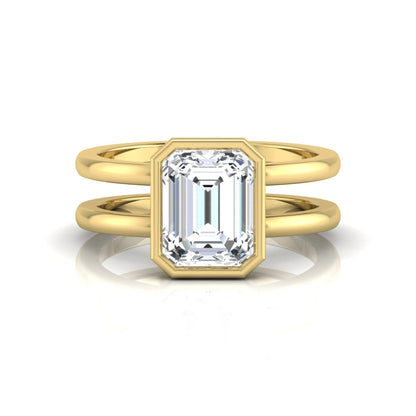 yellow-Gold ring with a rectangular diamond on a white background