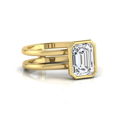 yellow-Gold ring with a large diamond on a white background