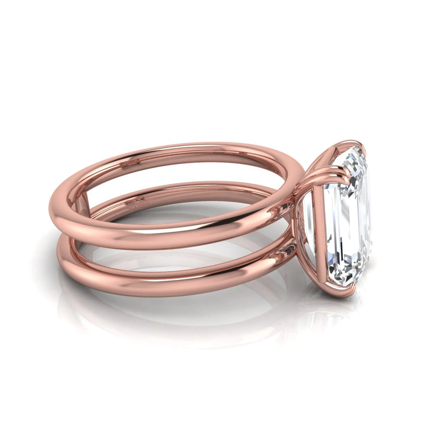 Emerald cut lab grown diamond double band engagement ring featuring a 3.01 carat IGI certified solitaire diamond in a four-prong setting in rose gold