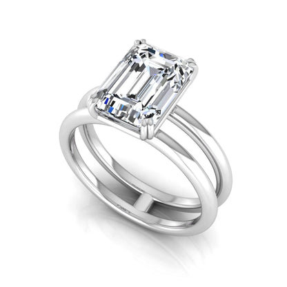 Emerald cut lab grown diamond double band engagement ring featuring a 3.01 carat IGI certified solitaire diamond in a four-prong setting in white gold