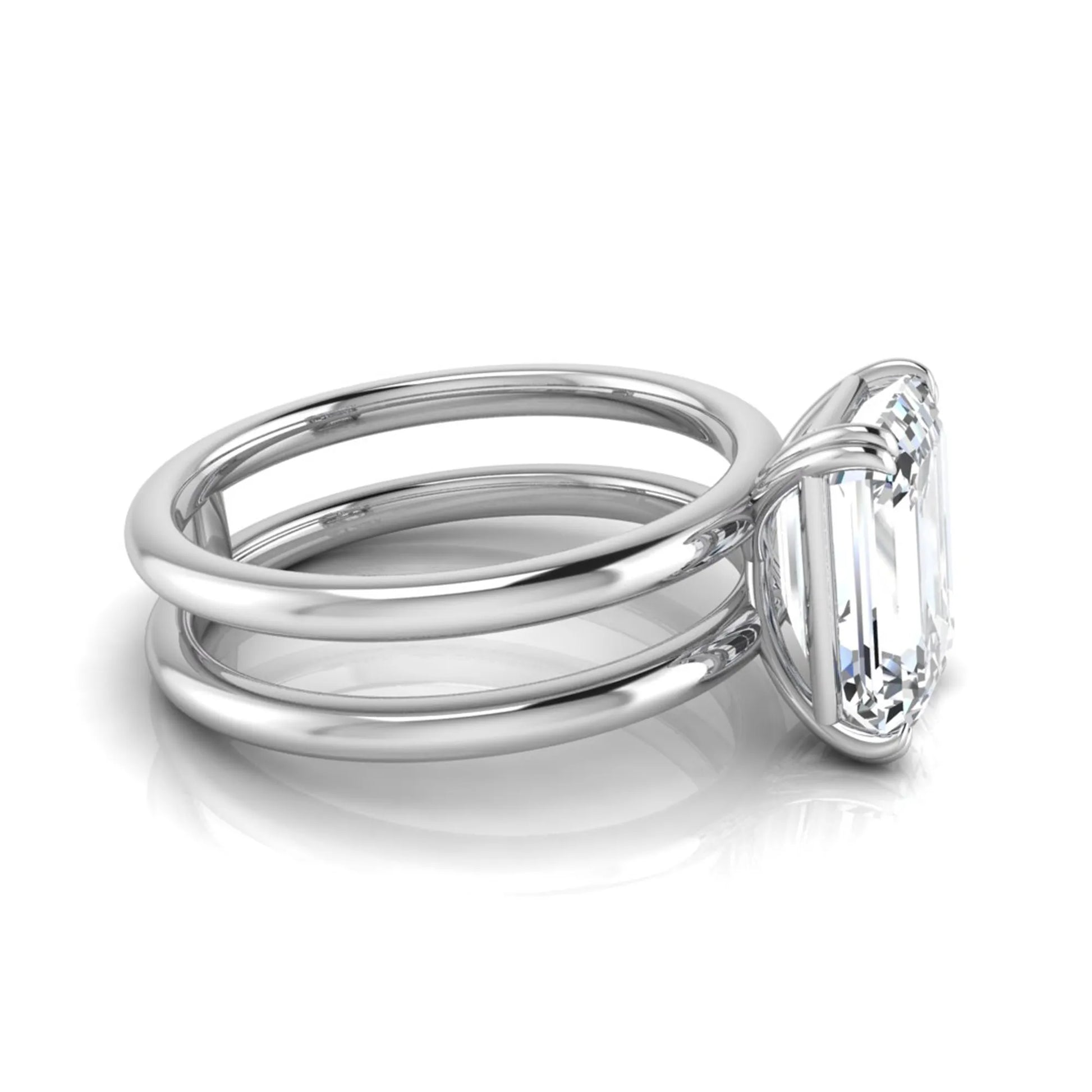 Emerald cut lab grown diamond double band engagement ring featuring a 3.01 carat IGI certified solitaire diamond in a four-prong setting in white gold