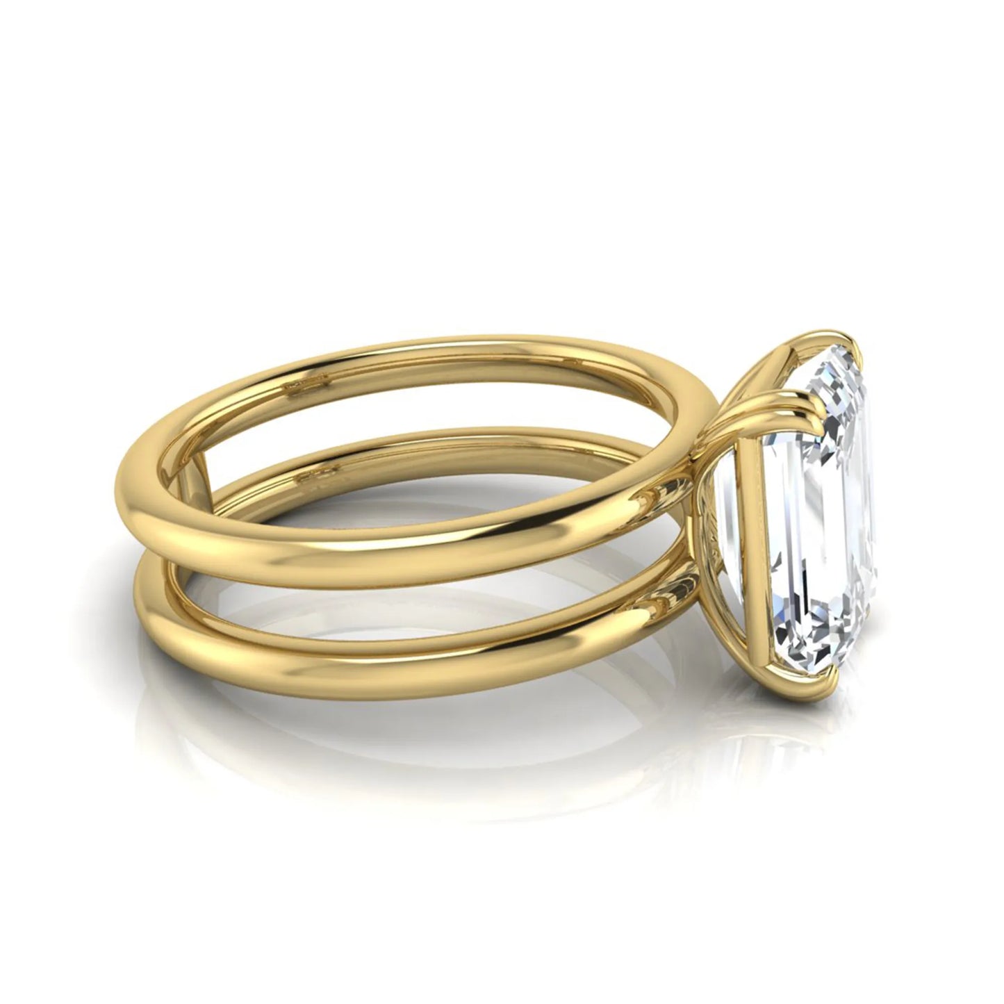 Emerald cut lab grown diamond double band engagement ring featuring a 3.01 carat IGI certified solitaire diamond in a four-prong setting in yellow gold