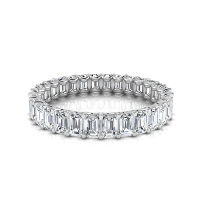 Emerald cut lab grown diamond eternity band featuring a continuous row of shared prong set diamonds in a timeless luxury design in white gold