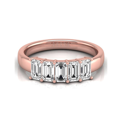 Emerald cut five stone lab grown diamond anniversary ring featuring five emerald cut diamonds in a shared prong setting with a rose gold tone band.