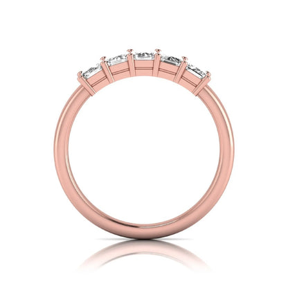 Emerald cut five stone lab grown diamond anniversary ring featuring five emerald cut diamonds in a shared prong setting with a rose gold tone band.