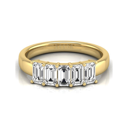 Emerald cut five stone lab grown diamond anniversary ring featuring five emerald cut diamonds in a shared prong setting with a yellow gold tone band.
