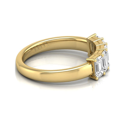 Emerald cut five stone lab grown diamond anniversary ring featuring five emerald cut diamonds in a shared prong setting with a yellow gold tone band.